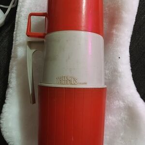 Red and White Thermos Brand Flask